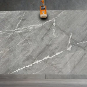 Premium Earth Grey Marble Slab from RMS-Traders, showcasing deep charcoal and smoky grey veining for luxury kitchen countertops and bathroom vanities.