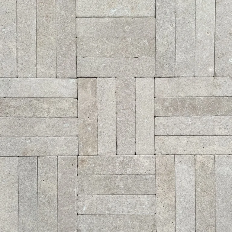 Haven Limestone Batons from RMS-Traders, featuring a contemporary linear design in soft, neutral grey and oatmeal tones with a textured finish for architectural feature walls.